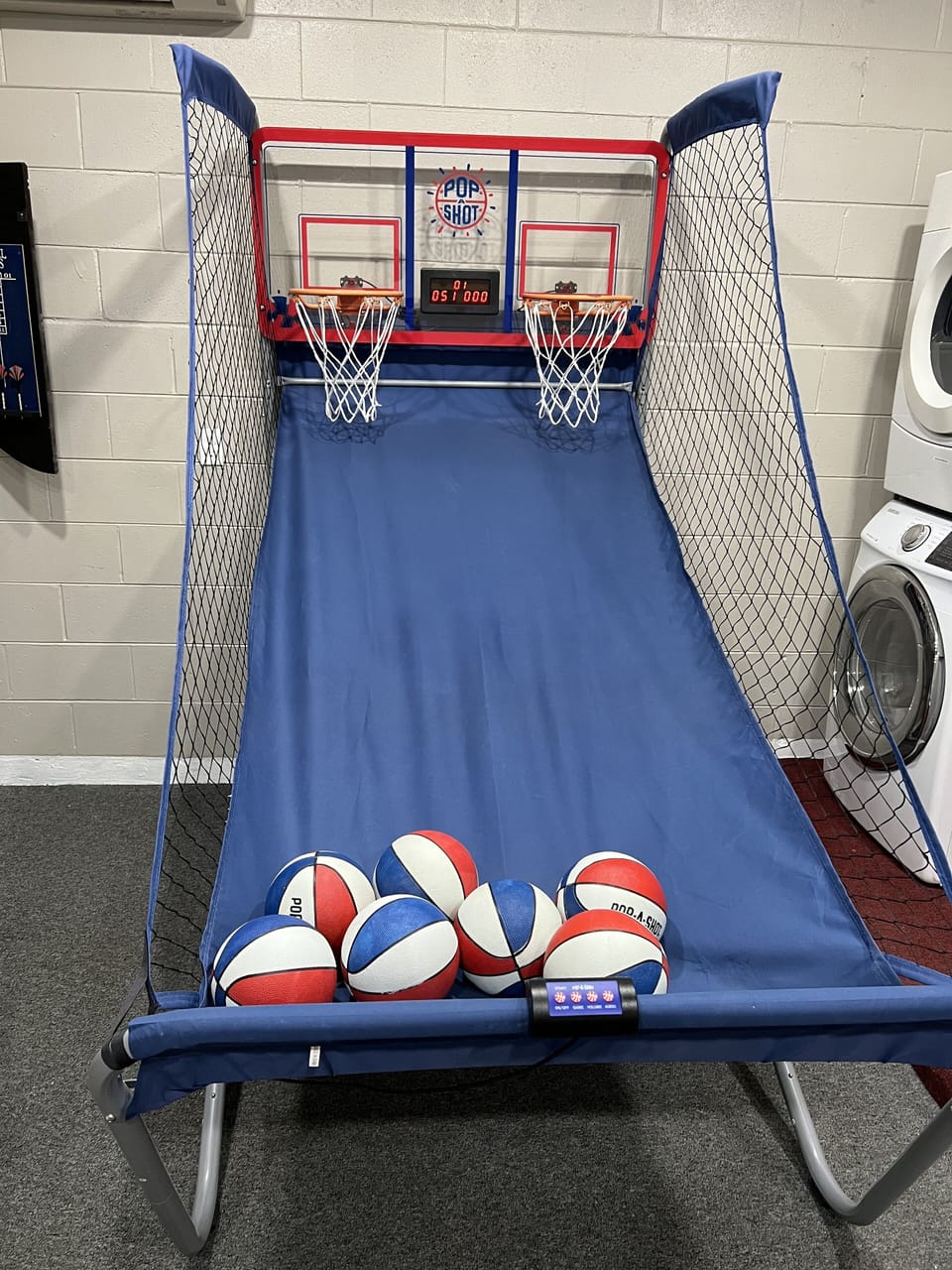 Basketball in the  game room.