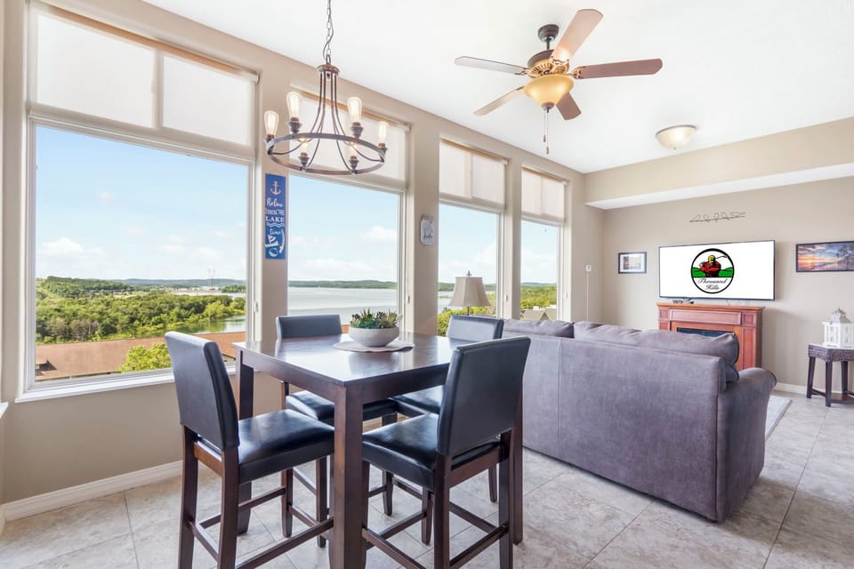 Fully Enclosed Sunroom with an Incredible View of Table Rock Lake, Extra Dining Space, Cable TV, and a Seasonal Fireplace