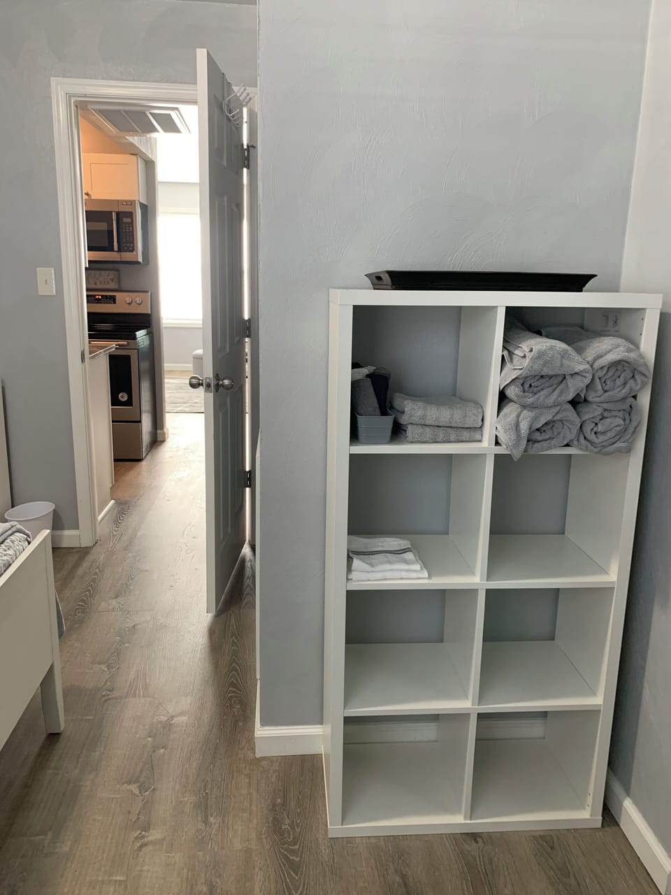 Linen storage for bath are in the spacious bedroom
