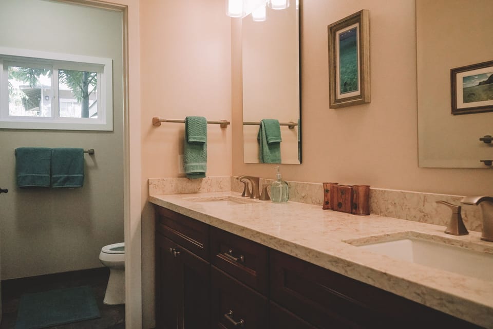 Downstairs bathroom, with dual sinks and shower/tub combo