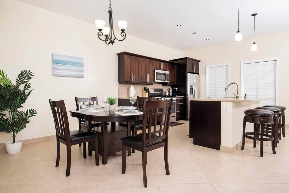 The dining room is a wonderful space to eat meals prepared in the fully functional, spacious kitchen that features stainless steel appliances. 