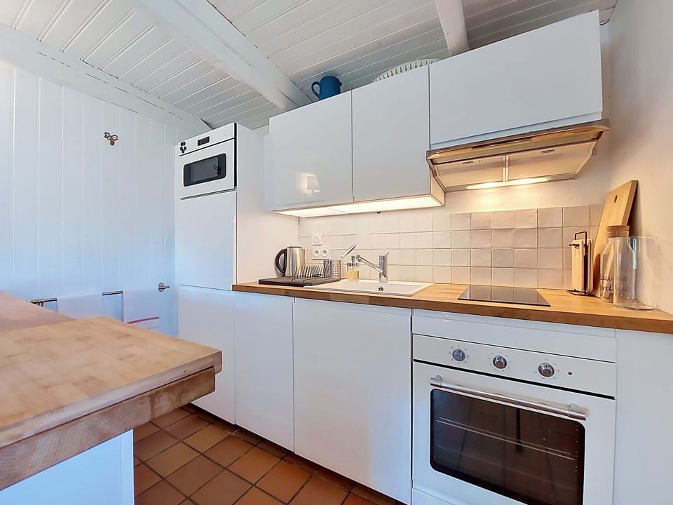 Kitchen, Countertop, Kitchen Appliance, Flooring, Major Appliance, Floor, Wood, Interior Design, Cabinetry, Plumbing Fixture