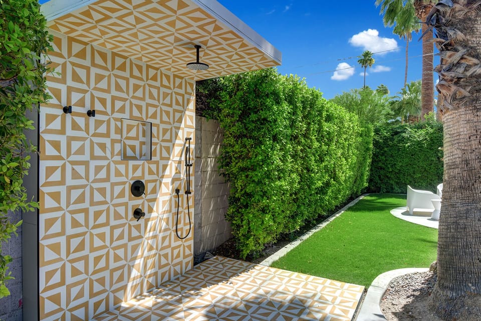 OUTDOOR SHOWER WITH MULTIPLE SHOWER HEADS. ACCESS FROM TWO BEDROOMS AND BACKYARD.  COMPLETELY PRIVATE