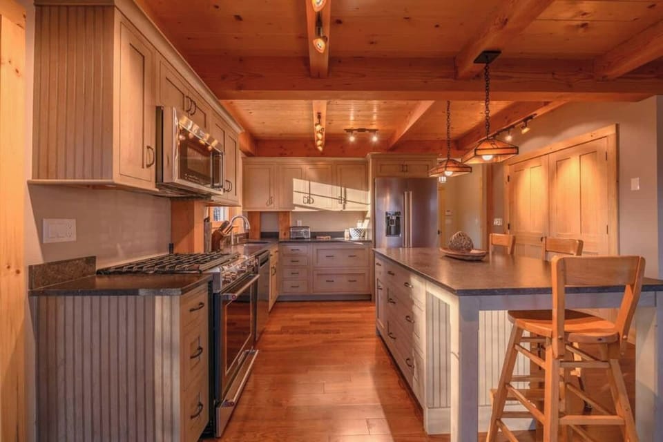 Chef's kitchen is bright and gives a wonderful sense of space for entertaining or simple home cooking. 