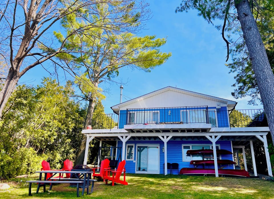 Firepit, muskoka chairs, outdoor picnic table and of course kayaks ~