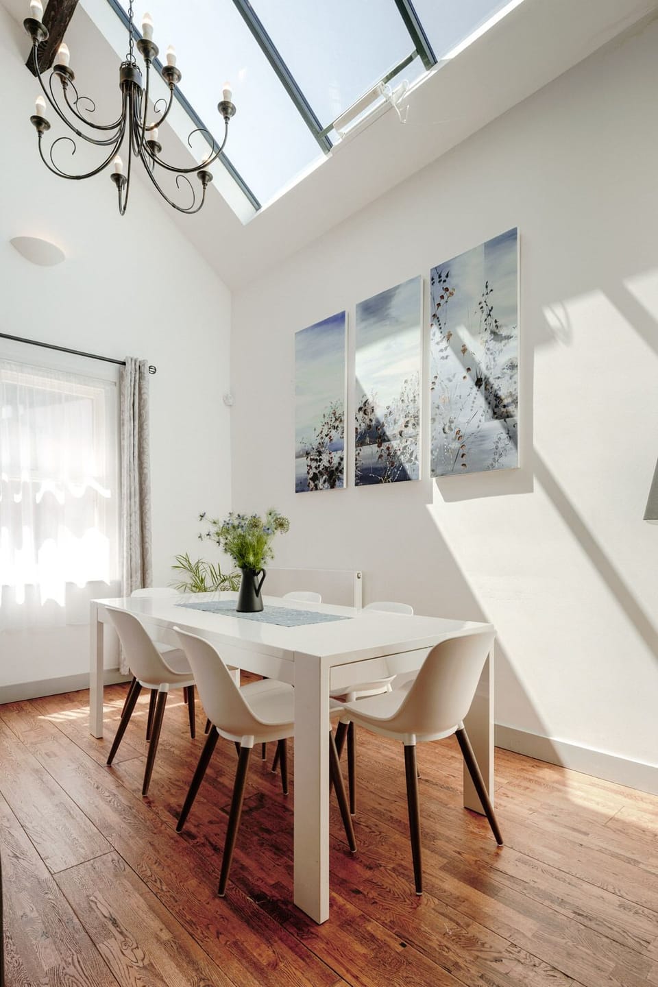 The bright dining area seats 6