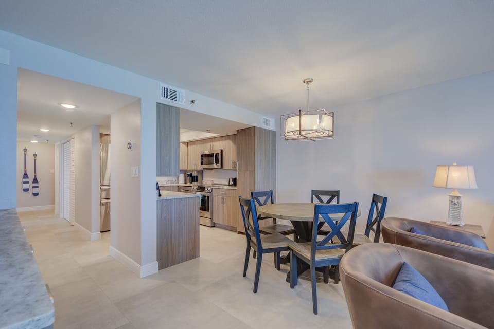 View of the dining table and kitchen.