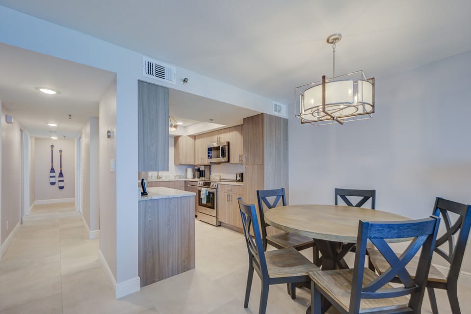 View of the dining table and the kitchen.