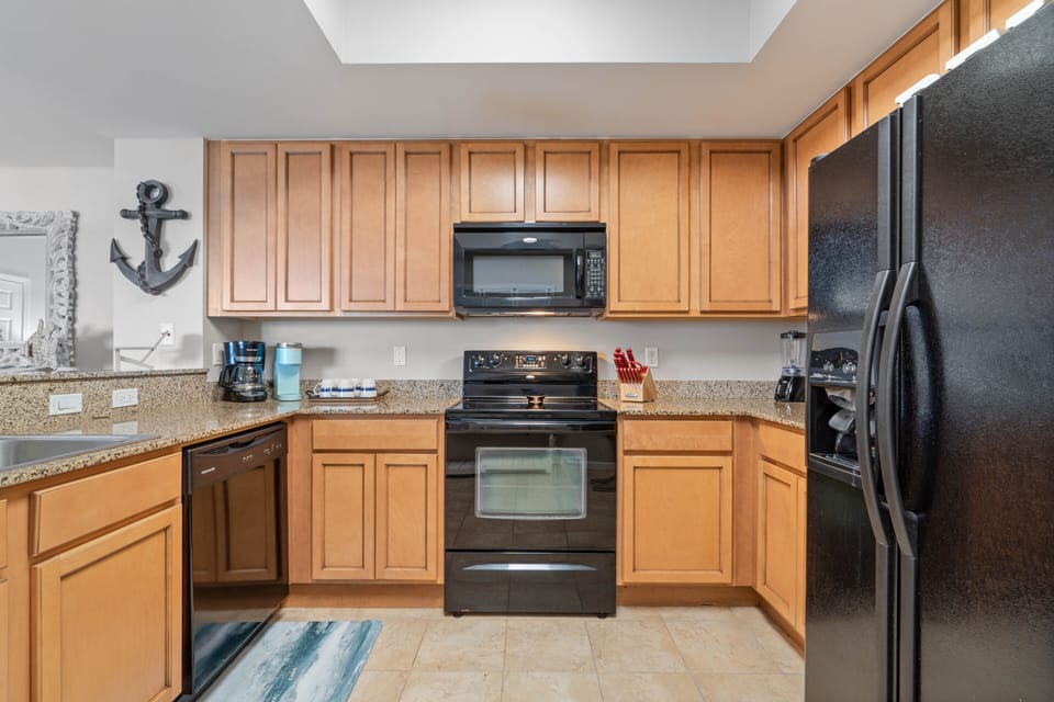 Spacious kitchen with all the comforts of home, Refrigerator with Ice Dispenser.