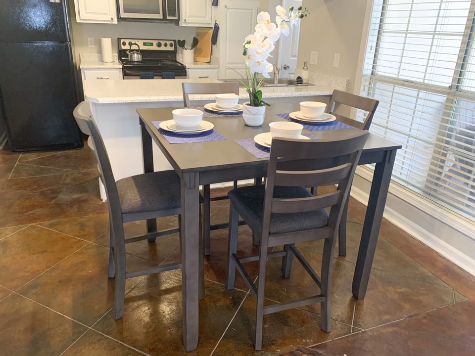 The kitchen has all amenities you'll need during your stay.