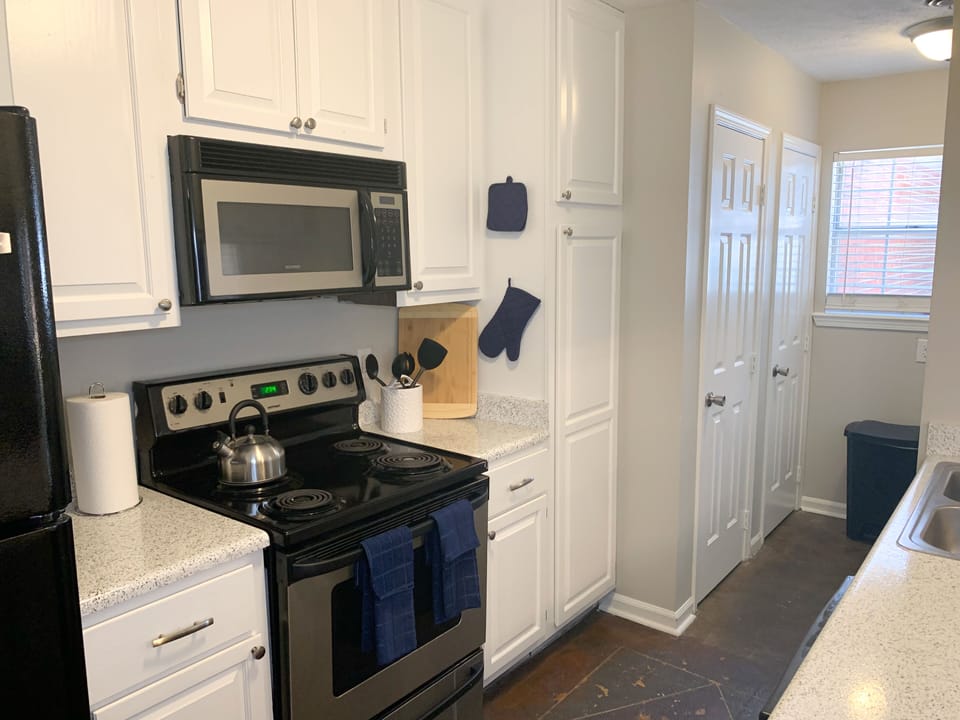 The kitchen has all amenities you'll need during your stay.