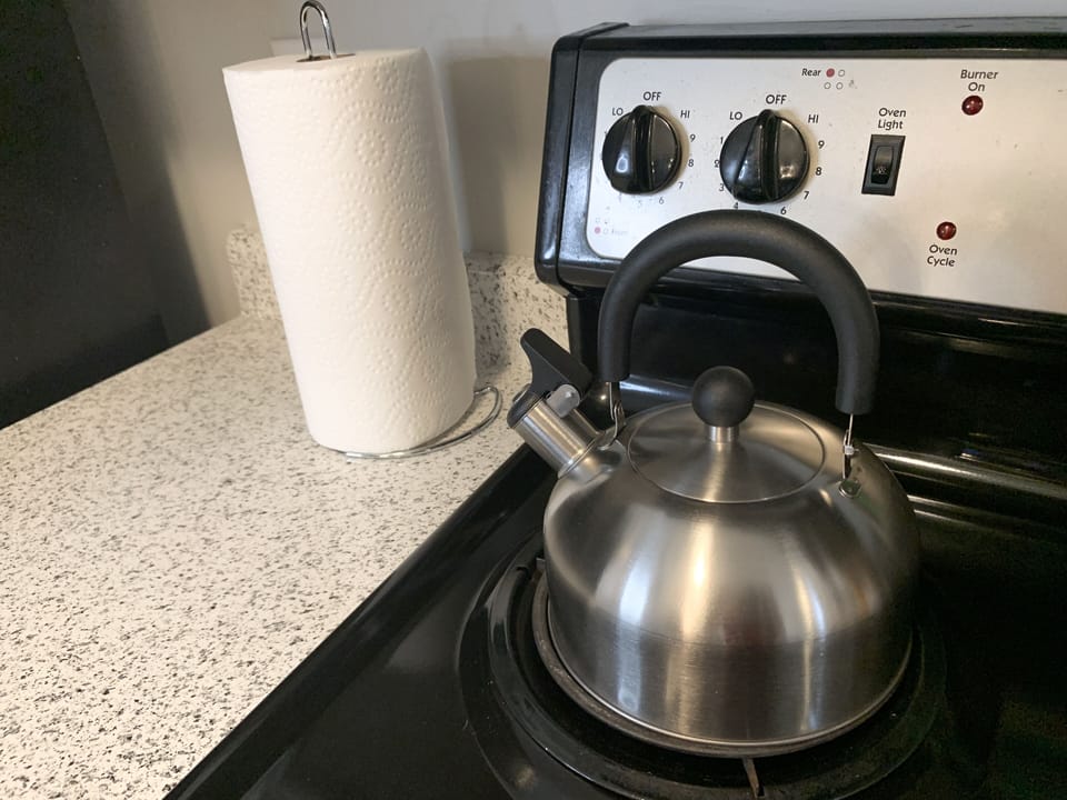 The kitchen has all amenities you'll need during your stay.