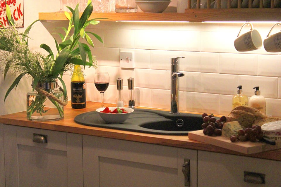 Kitchen, with fridge and kettle, toaster, cooker, dishwasher and utensils