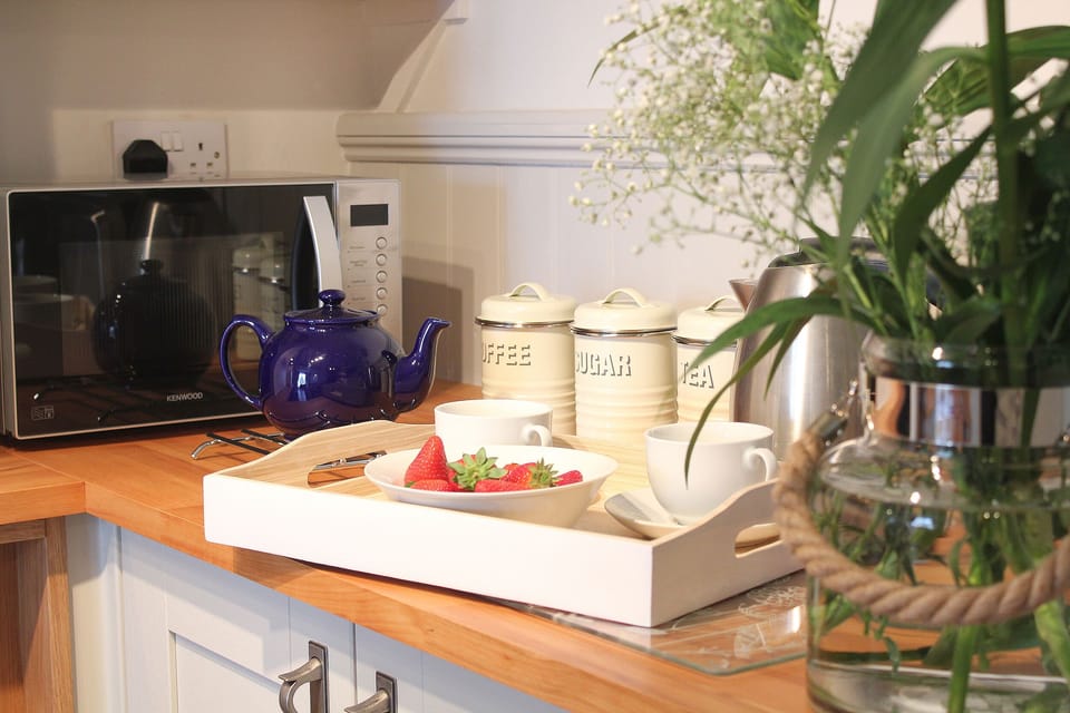 Kitchen, with fridge and kettle, toaster, cooker, dishwasher and utensils