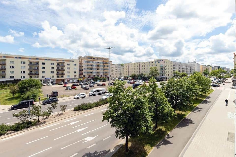 The balcony's stylish decor complements the apartment's modern design.