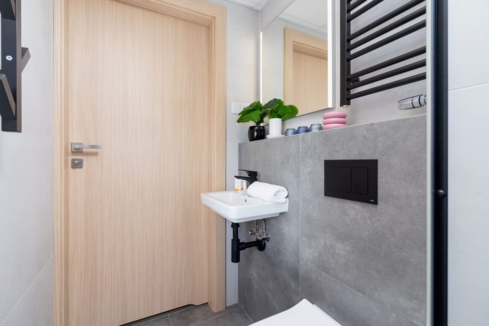 The bathroom's stylish design provides a relaxing environment. 