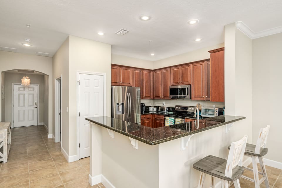 Additional seating at the kitchen counter.