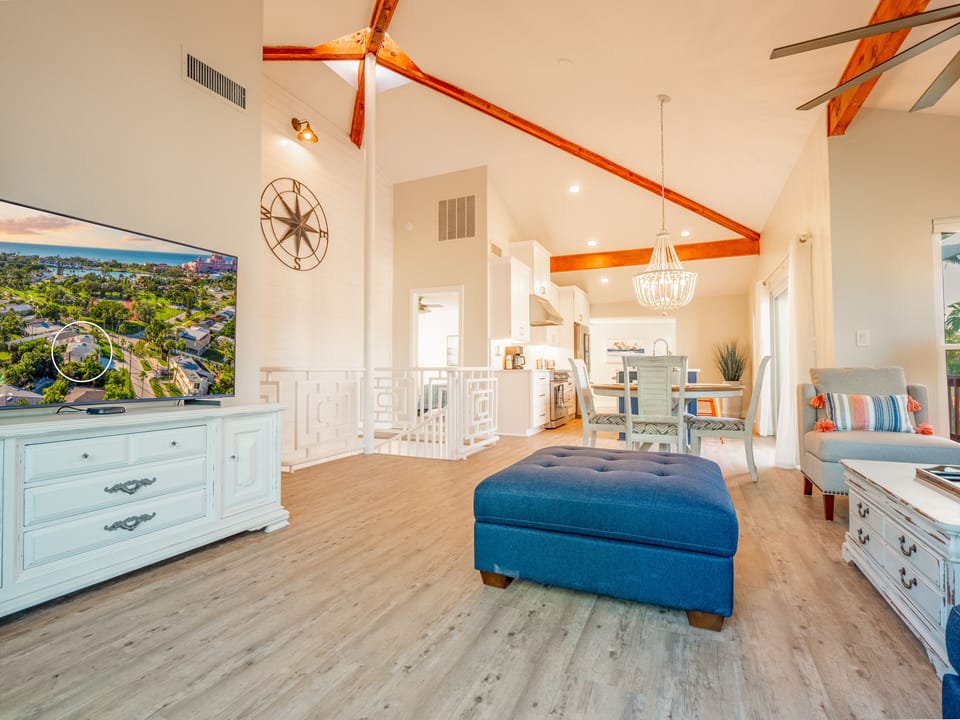 Light & bright open living area w/soaring vaulted ceilings and central skylight.