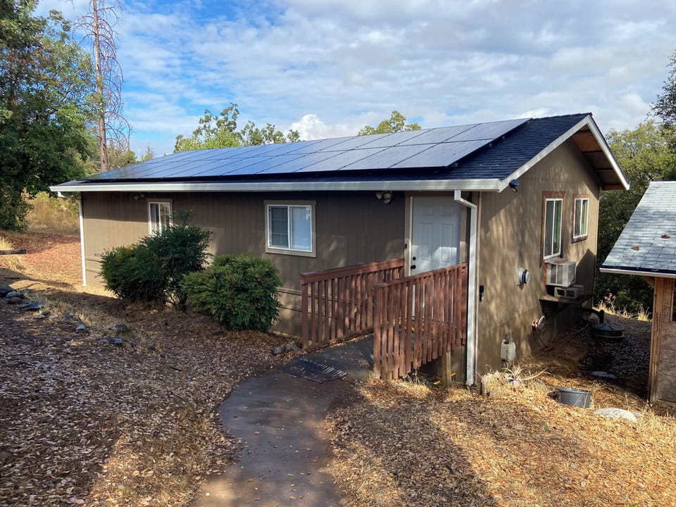 Front of guest house. Supply shed to right that cleaner will access sometimes.