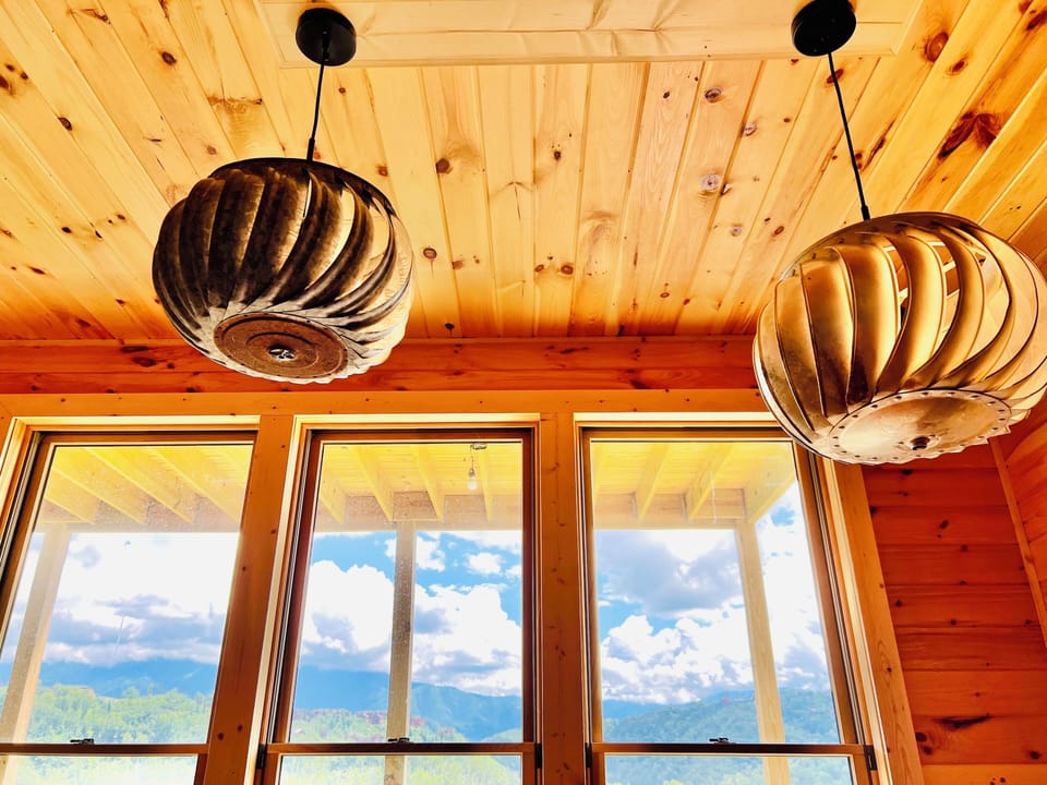 Unique handcrafted light fixture from vintage attic vents.