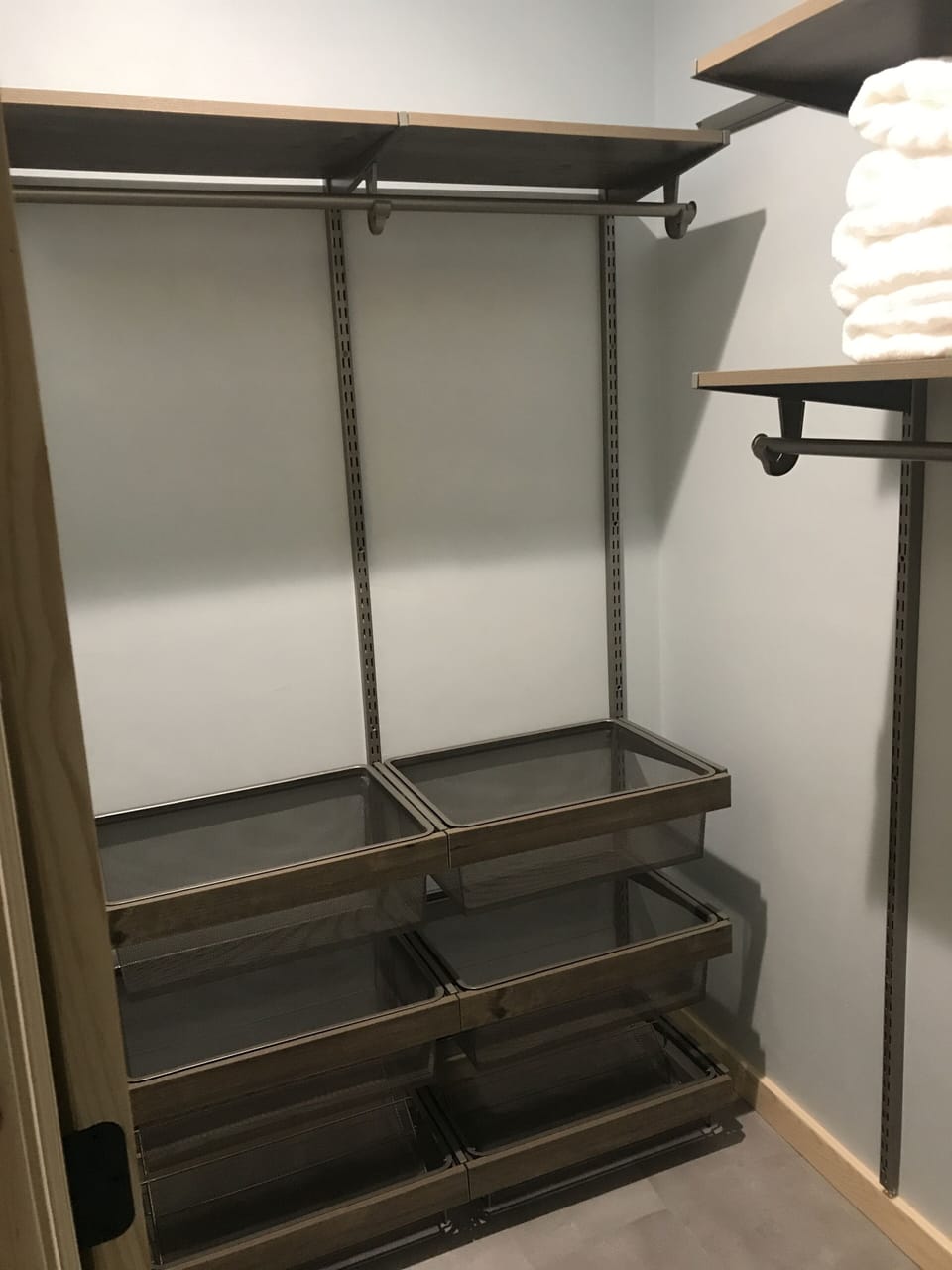 walk-in closet in master bedroom. pull out drawers for shoes and clothing