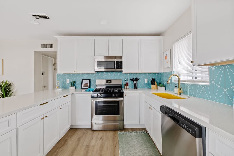 Completely remodeled modern kitchen with every major appliance, soft-close doors/drawers and stunningly beautiful quartz counter tops.