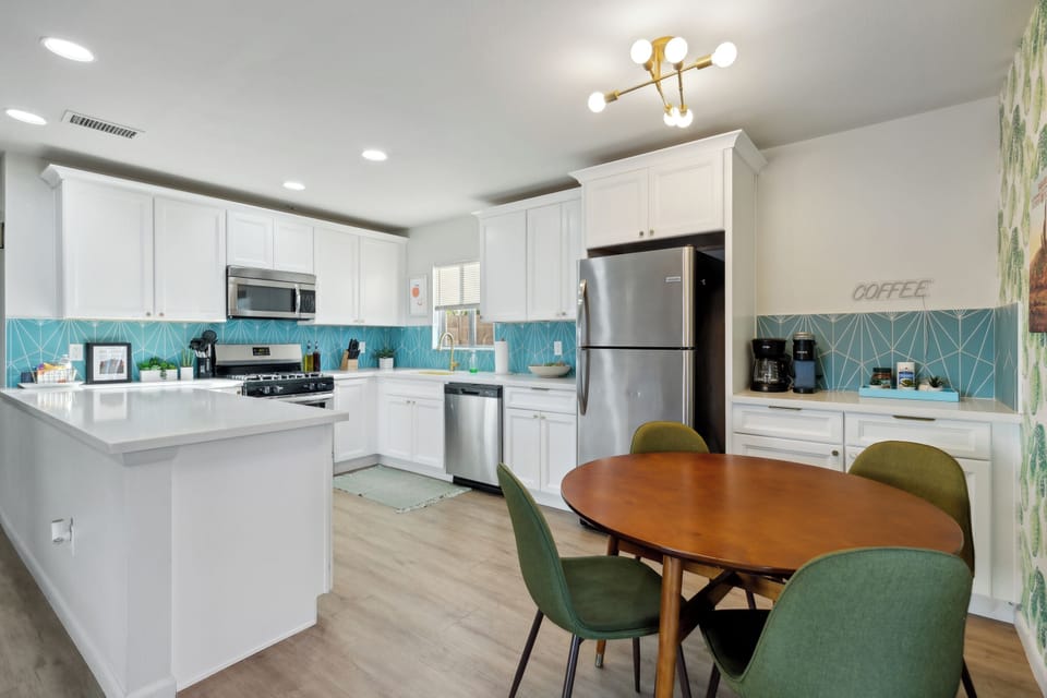 Wider angle view of the kitchen and dining area just off the double glass sliding doors.