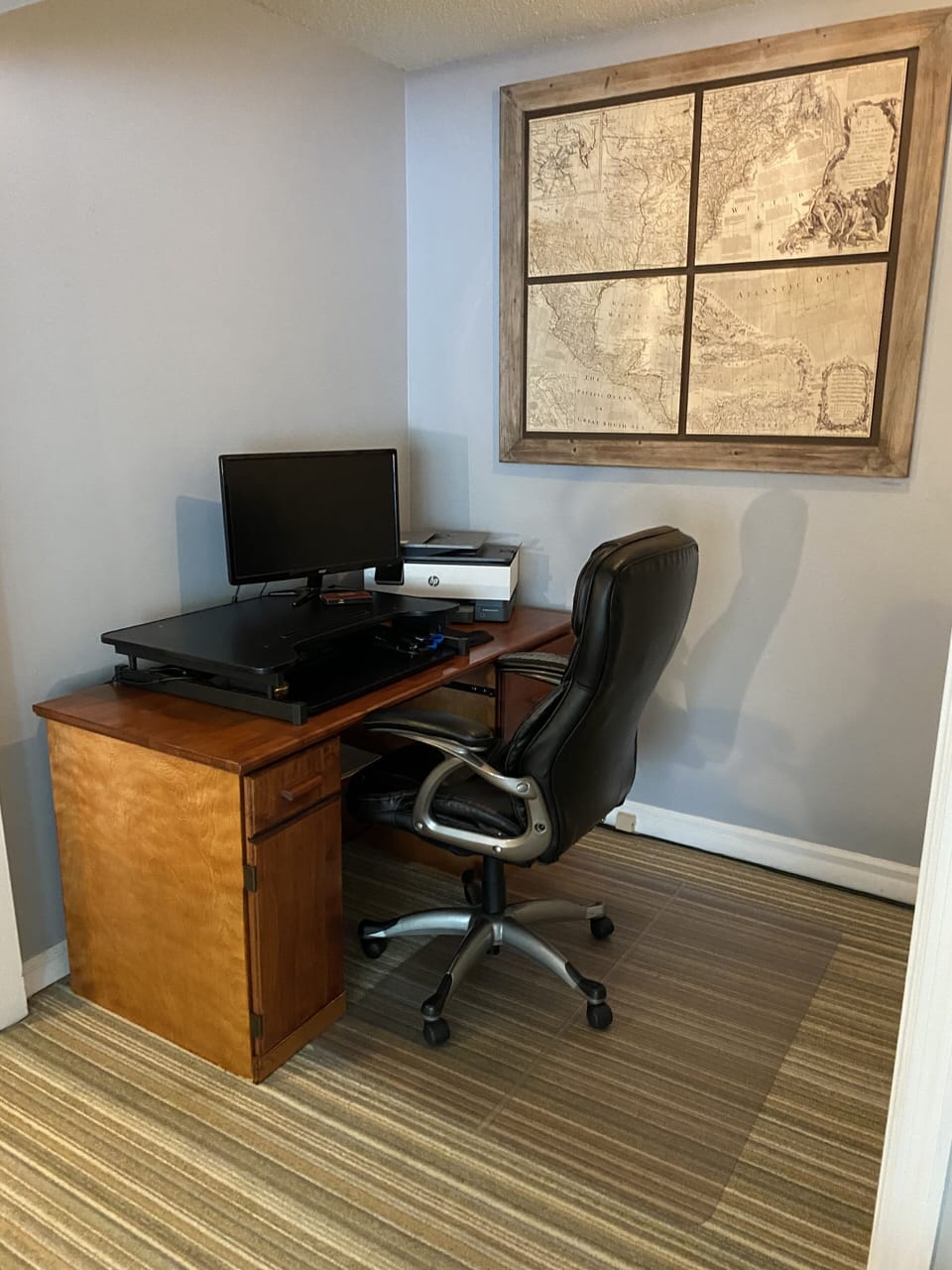 Home office includes WiFi printer, standing desk,  and extra monitor