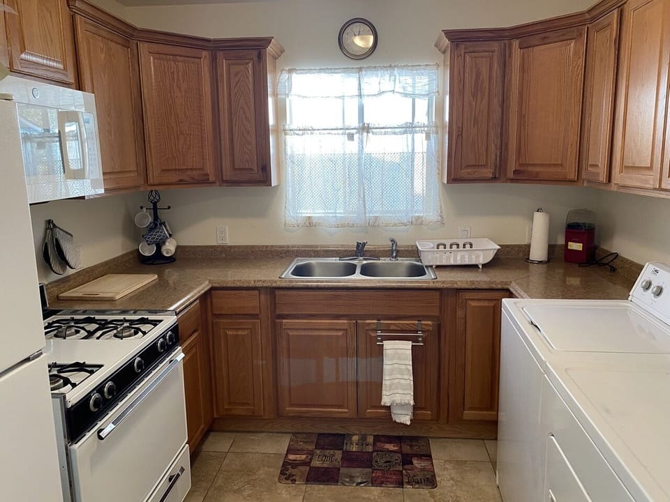 Kitchen with washer and dryer.