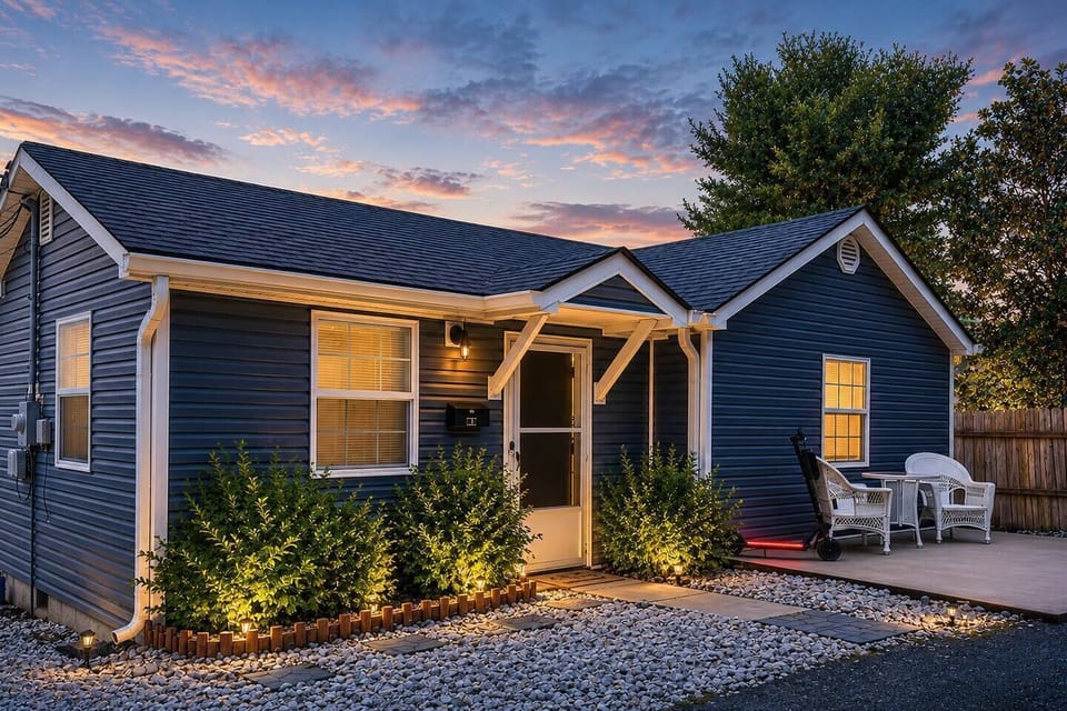 Arrive to a beautifully illuminated home featuring warm exterior lighting, lush landscaping, and a relaxing front patio. A cozy first impression that sets the tone for a comfortable and memorable stay.