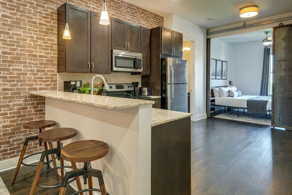 Fully equipped kitchen stocked with your basic cooking essentials. Complete with granite counter tops, stainless steel appliances, and breakfast bar seating.
