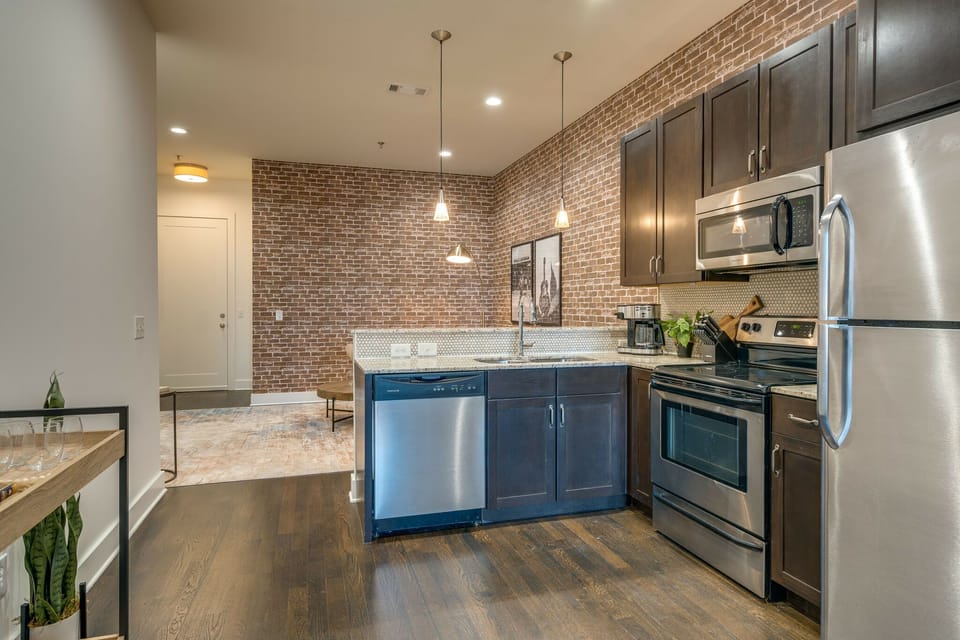Fully equipped kitchen stocked with your basic cooking essentials. Complete with granite counter tops, stainless steel appliances, and breakfast bar seating.