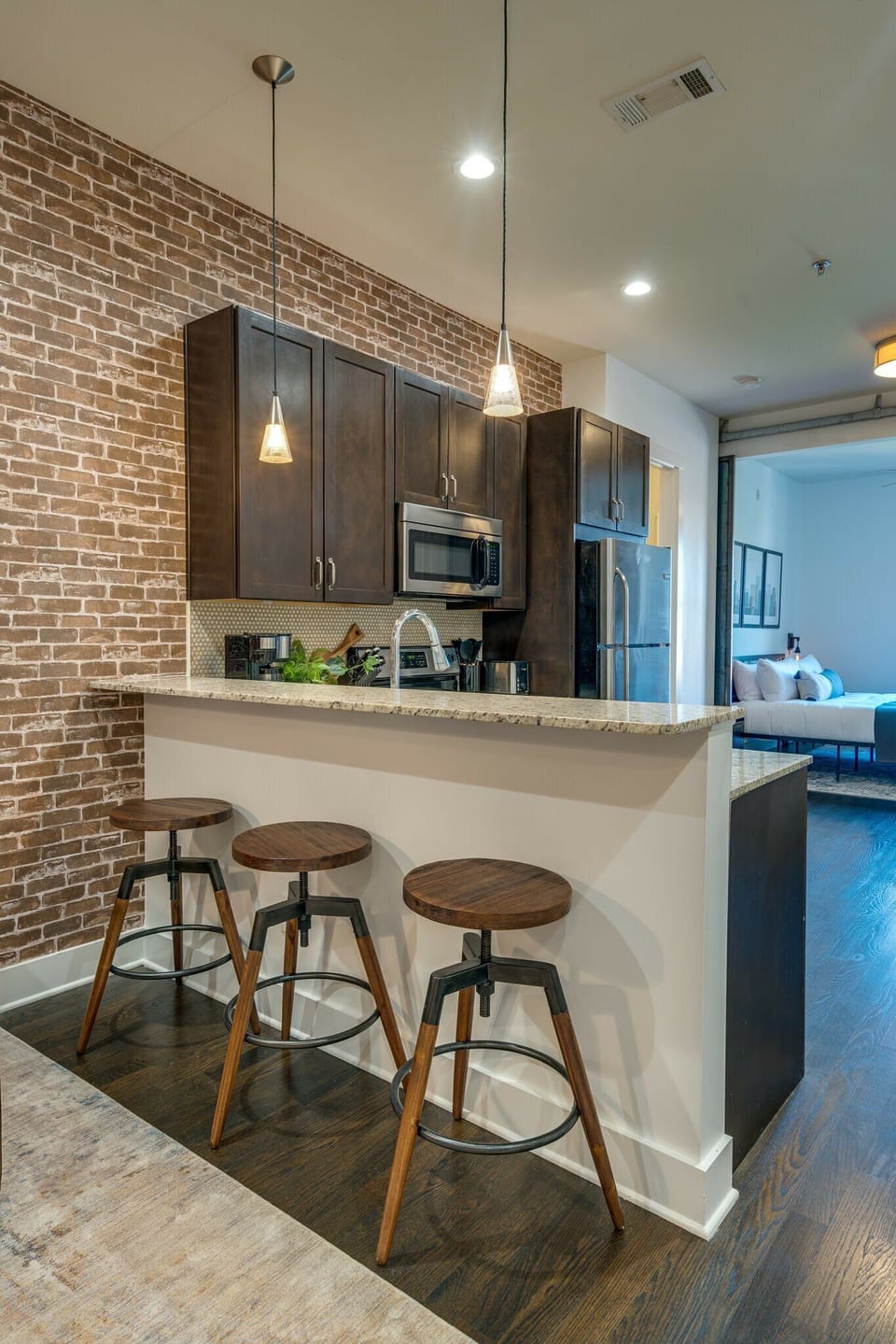 Fully equipped kitchen stocked with your basic cooking essentials. Complete with granite counter tops, stainless steel appliances, and breakfast bar seating.