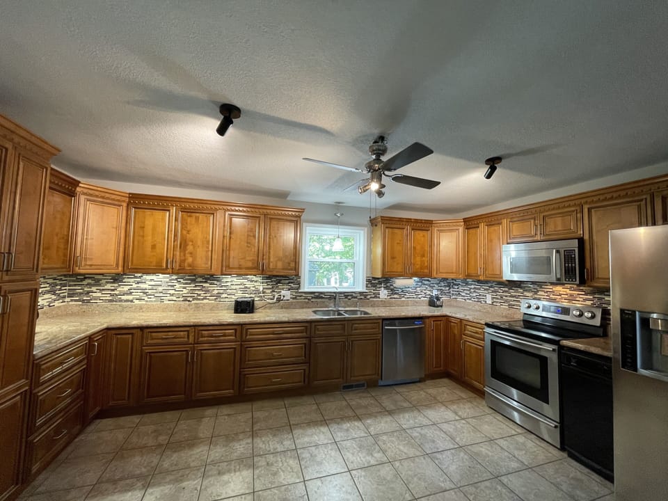 Well stocked well lit kitchen with undercabinet lights