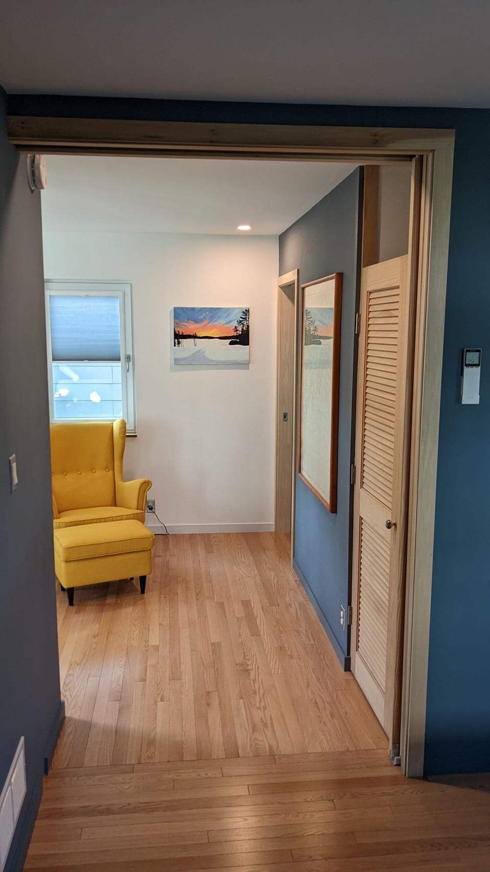 Double french doors slide open to connect main bedroom to the second floor space