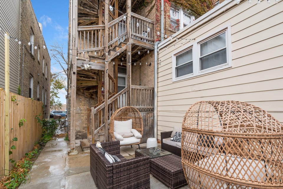 Cozy backyard with grill multiple seatings and Dining table for 8