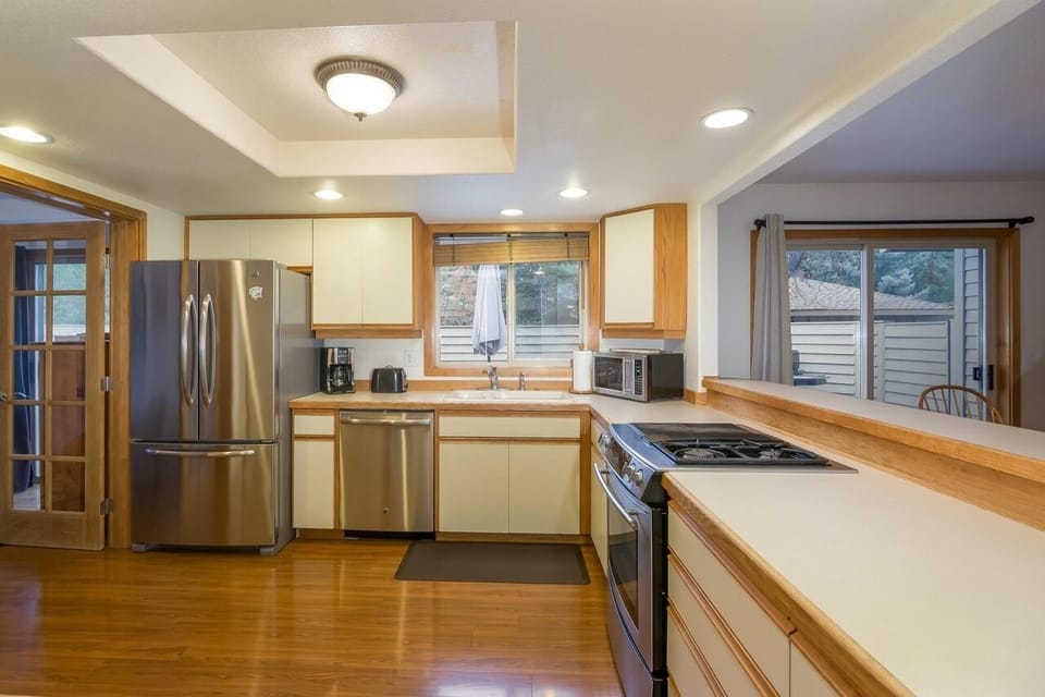 Large fully equipped kitchen with stainless appliances