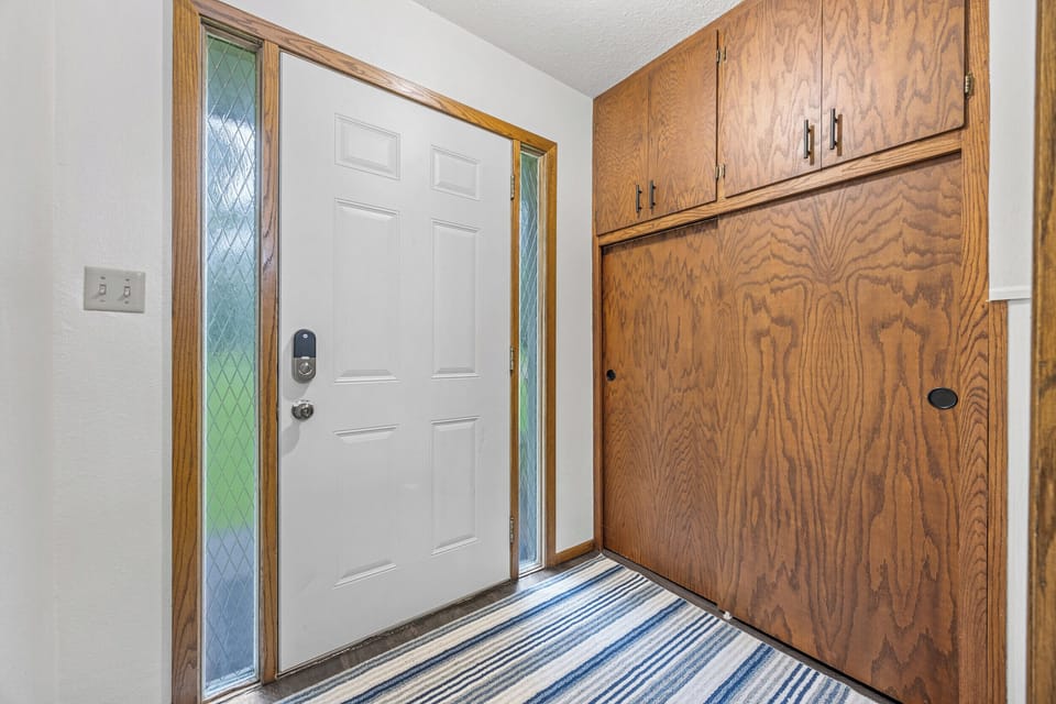 Large entry way with access to second floor and downstairs walkout family room