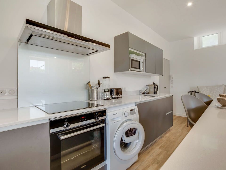 Cabinetry, Property, Countertop, Laundry Room, Washing Machine, Kitchen Appliance, Clothes Dryer, Home Appliance, Kitchen Stove, Kitchen