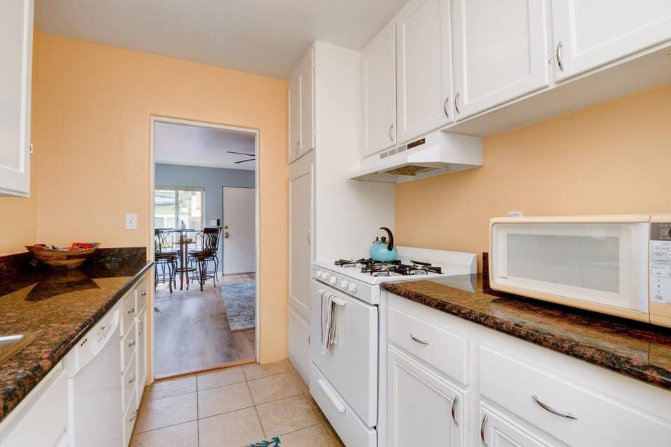 Kitchen - Fully stocked with stove, refrigerator, microwave, fridge, toaster, Keurig coffee maker, dishes, pots and pans, etc.