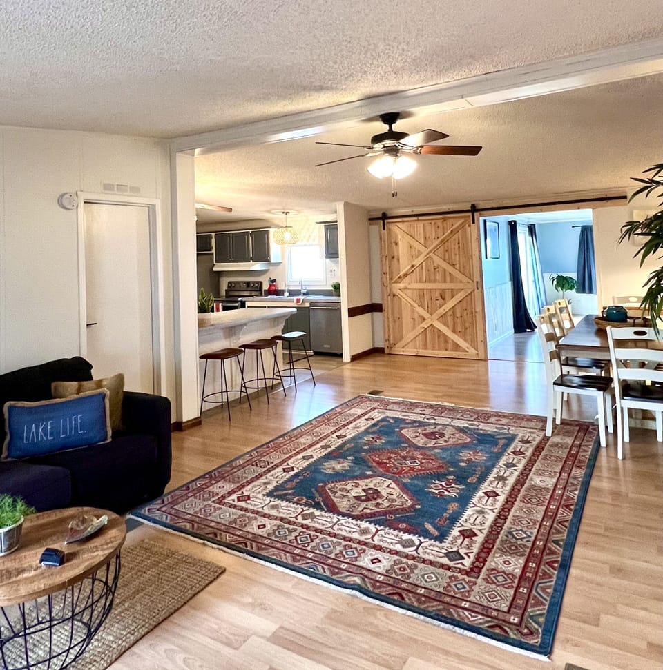 Barn door provides privacy between two living areas 