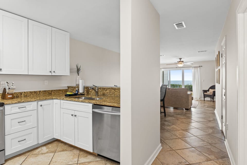 Outfitted with sleek stainless steel appliances, granite countertops, and all the essentials for effortless vacation meals, it's designed to make cooking feel like part of the getaway.