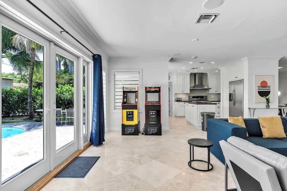 Fun meets comfort in this modern vacation rental—perfect for short-term stays and group getaways. Enjoy a sleek kitchen, cozy lounge, poolside access, and arcade games for unforgettable leisure and relaxation.
