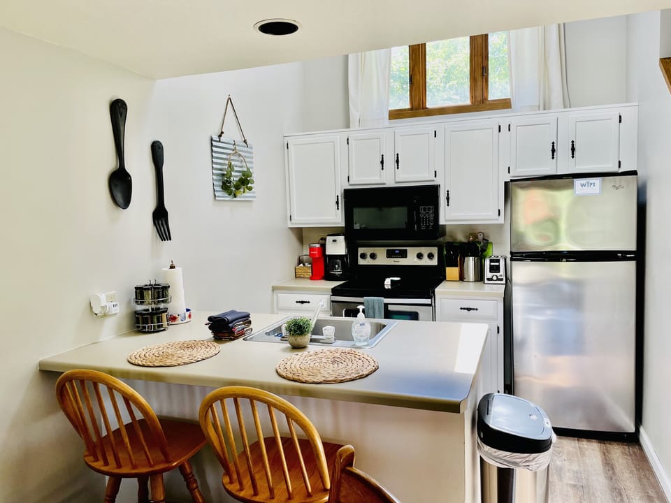 Main Floor kitchen is fully stocked with quality cookware, utensils, and spices