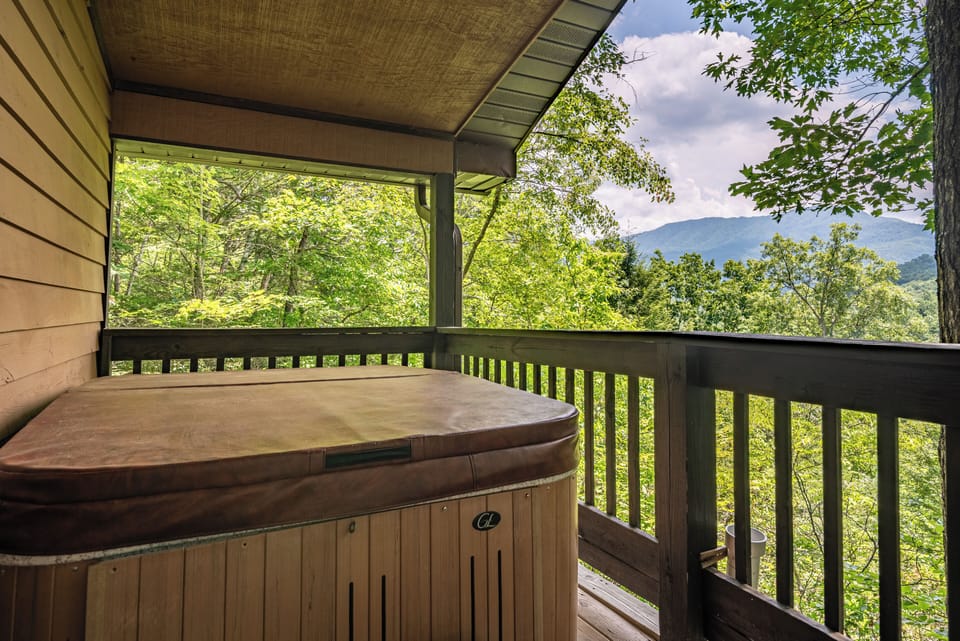 Hot Tub Retreat: Unwind in the bubbling hot tub with stunning mountain views all around!