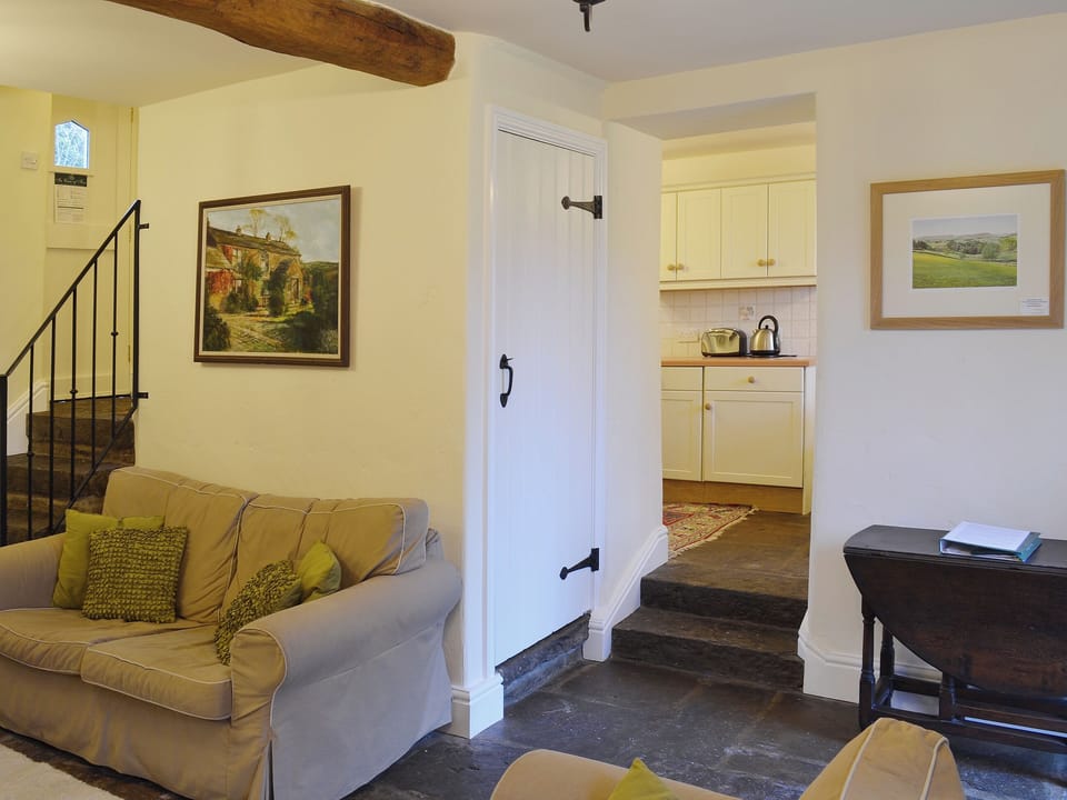 Flag-floored living room gives way to cosy kitchen/dining room | Dewsnaps Frost - Dewsnaps, Chinley, near Chapel-en-le-Frith