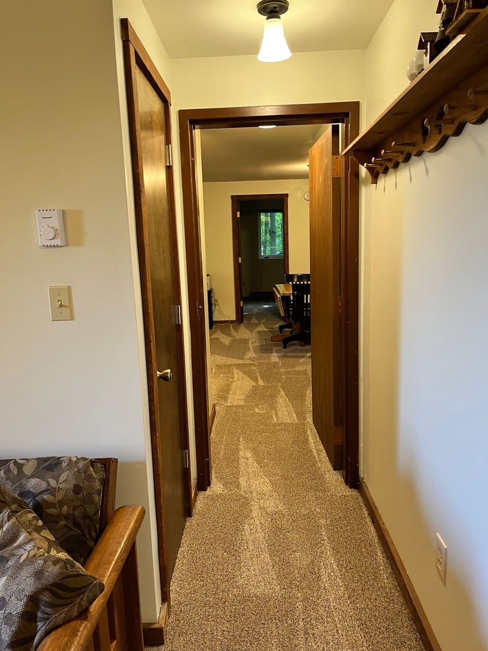 Basement rec room hallway leads to family room.