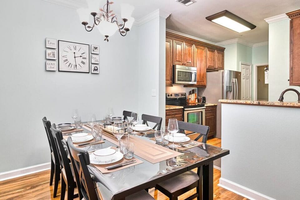 Enjoy delightful meals with family and friends at our wooden dining table for six.