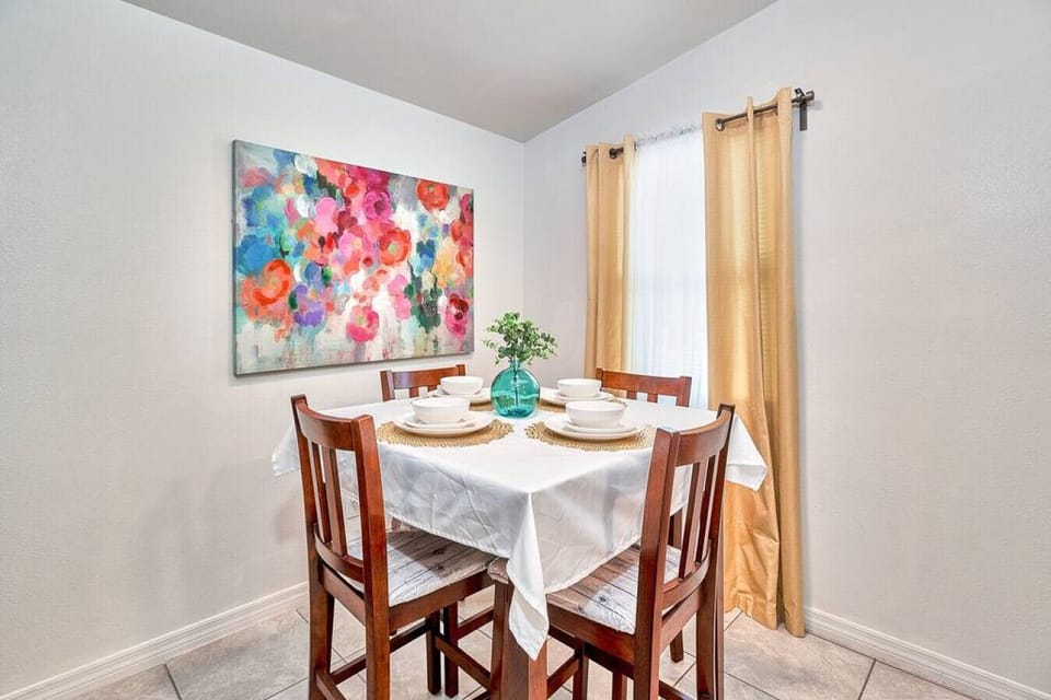 You'll encounter a lovely wooden dining table for 4, perfect for sharing meals