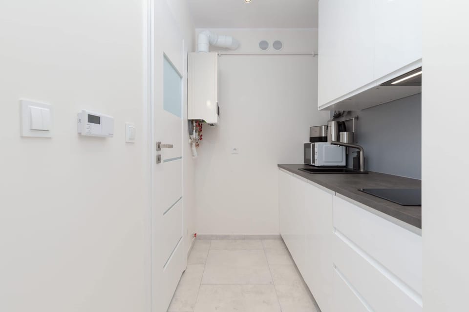 The fully equipped kitchenette includes everything you need for a home-cooked meal.